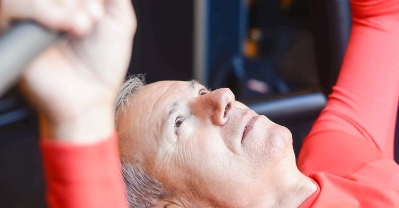 Strength Exercises - Man Training on Gym with Barbell