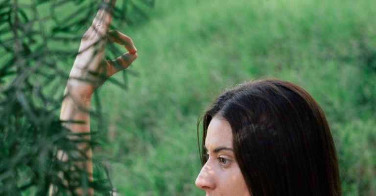Recovery - Serene woman practicing yoga in forest