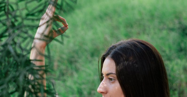 Recovery - Serene woman practicing yoga in forest