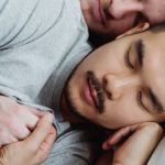Sleep - Two Men in Bed Holding Hands