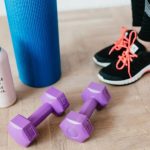 Home Workouts - Crop female athlete with sport accessories