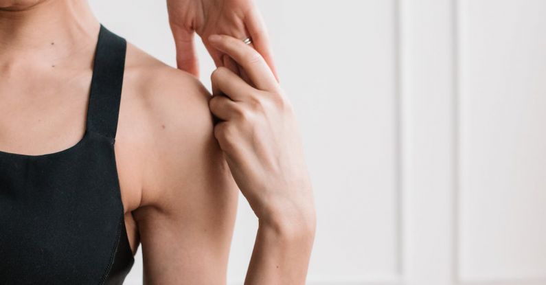 Home Workouts - Young Woman in Black Sports Bra and Black Leggings Doing Home Workout