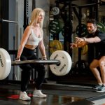 Deadlift - Woman Holding Barbell at Gym
