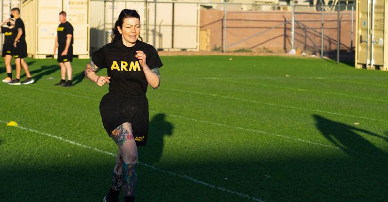 Steady-State Cardio - Woman Running on Sports Ground