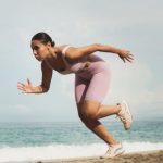 Warm-Up - Woman Running on Beach