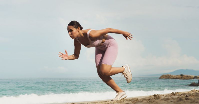 Warm-Up - Woman Running on Beach