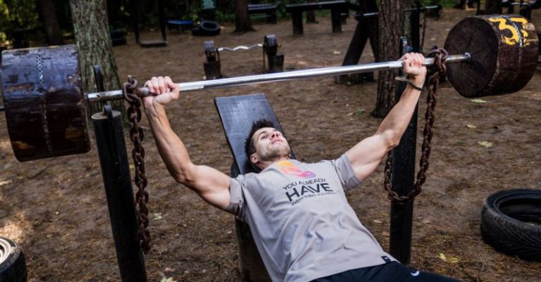 Bench Press - Man in Grey Shirt and Black Bottom Lifting Barbell