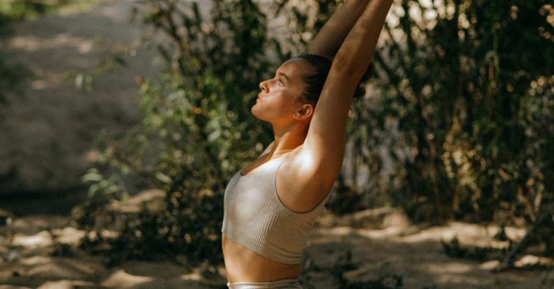 Yoga Poses - A Woman Doing Yoga in the Forest