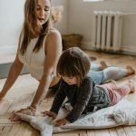 Stretching Post-Workout - Woman Wearing White Sleeveless Top