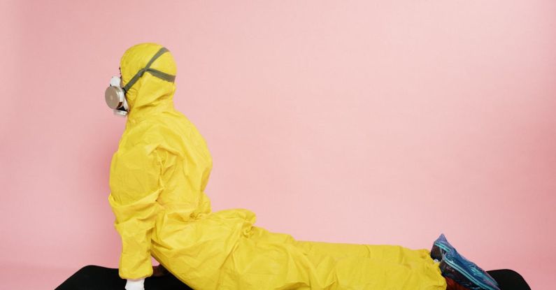 Safe Stretching - Man In Yellow Protective Suit Stretching