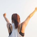 Motivated - Woman Wearing Black Bra and White Tank Top Raising Both Hands on Top