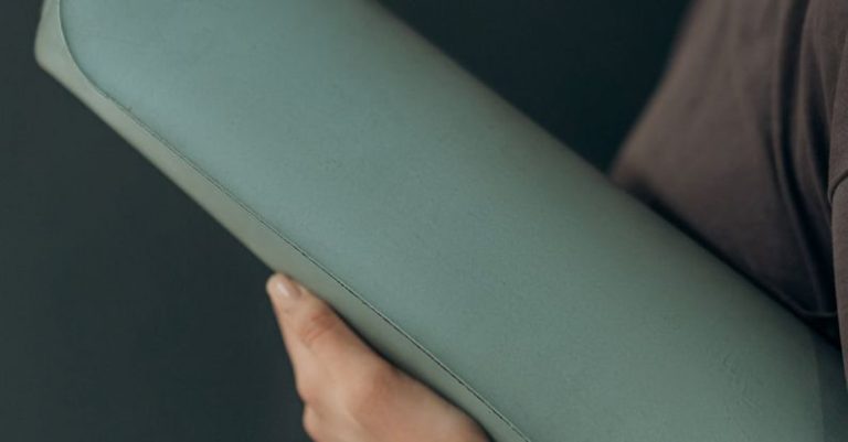 Fitness Routine - Woman Holding A Yoga Mat