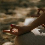 Yoga Poses - Close-up Shot of a Person Sitting on a Yoga Mat while Meditating