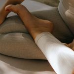 Yoga Practice - A Woman in Activewear Sitting on a Yoga Mat