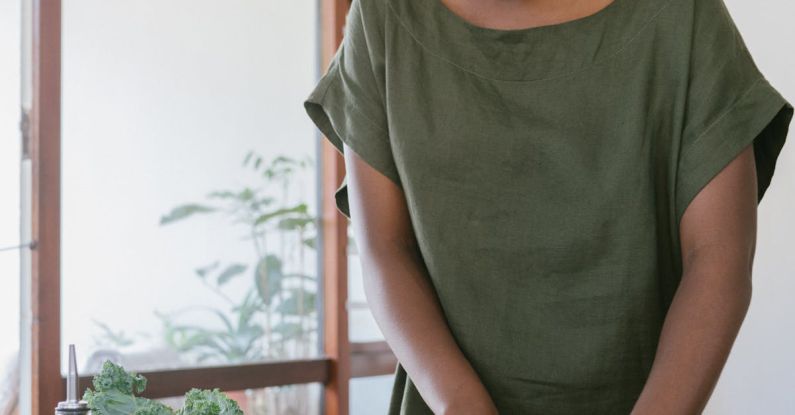 Balanced Diet - Woman in Green Tank Top Holding Orange Bell Pepper