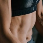 Cardiovascular Endurance - Anonymous fit sportswoman relaxing after training training