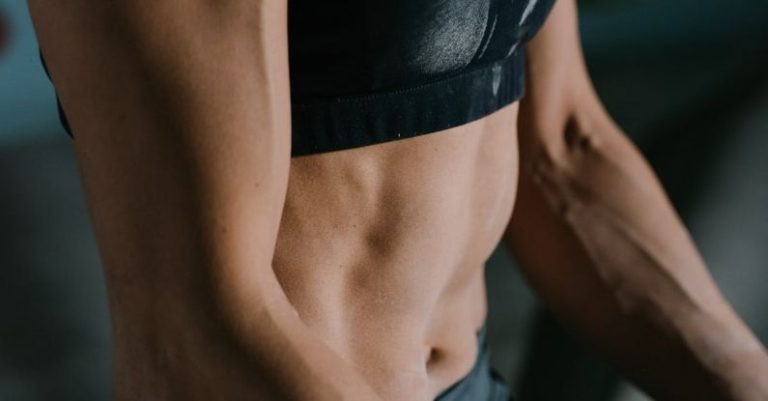 Cardiovascular Endurance - Anonymous fit sportswoman relaxing after training training